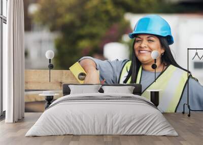 Ive got all the tools I need to succeed. Cropped portrait of an attractive young female construction worker working on site. Wall mural