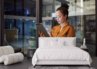 tablet, working at night and woman employee planning or typing digital strategy in an office. busine Wall mural