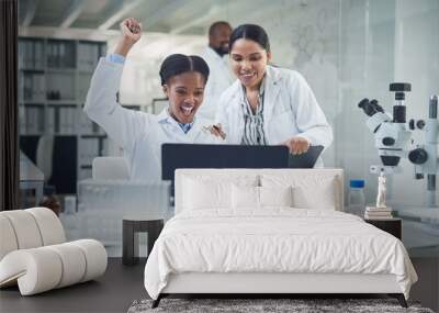 Well make history with this. Shot of a group of scientists cheering while working in a lab. Wall mural