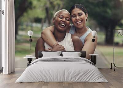 You always make me smile. Shot of two female friends taking a break during their workout. Wall mural