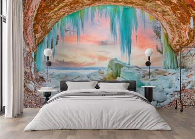 Stunning ice cave on Lake Michigan during sunrise with large blue icicles Wall mural