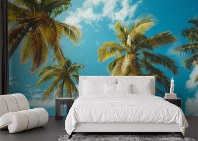 This vibrant and striking image showcases palm trees towering against a clear blue sky, evoking feelings of warmth, tranquility, and the perfect tropical getaway. Wall mural