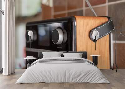 Modern, DAB and digital streaming radio seen located in a kitchen. The modern design, wooden cabinet and push buttons are visible on this radio set. Wall mural