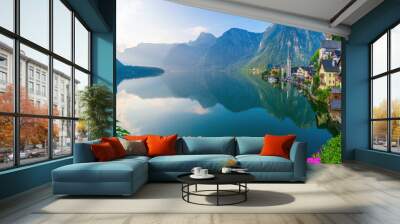 Hallstatt, Austria - A scenic picture postcard view of the famous village of Hallstatt reflecting in Hallstattersee lake in the Austrian Alps. Wall mural