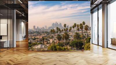 Los Angeles skyline at sunset with palm trees in the foreground Wall mural