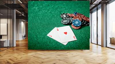 aces and chips on a green felt Wall mural