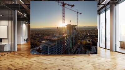 Sunset over construction cranes in Denver, Colorado Wall mural