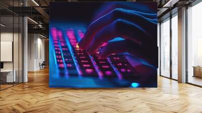 Close-up computer keyboard glowing in dark as digital technology background Wall mural