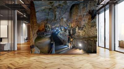 Young Caucasian Backpacker in Phong Nha Cave in Vietnam Wall mural