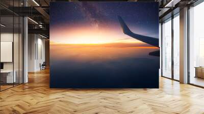 Airplane is flying at night. Space Milky Way view from plane window. Dark clear starry sky Wall mural