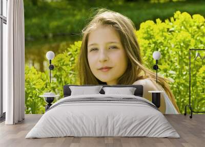 Cute young girl in a park Wall mural