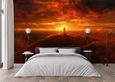 a man stands on a hill at sunset Wall mural