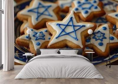 Hanukkah Cookies with Star of David: A close-up of homemade Hanukkah cookies shaped like the Star of David and dreidels, decorated with blue and white icing. The cookies are arranged on a festive plat Wall mural