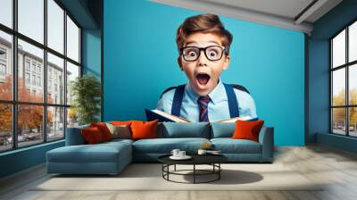 Surprised young boy in glasses and with a backpack engrossed in reading a book against a blue background. Modern back-to-school concept.

Generative AI Wall mural