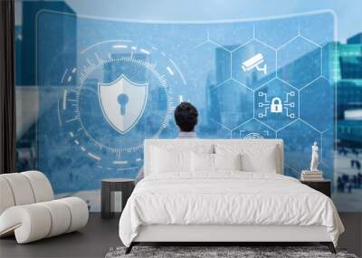 Cyber security and network protection. Cybersecurity expert working with secure access on internet. Concept with icons on screen and office buildings in background. Wall mural