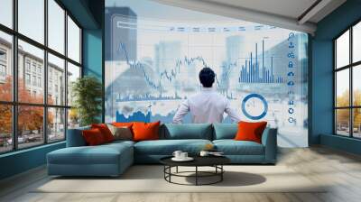 Finance trade manager analysing stock market indicators for best investment strategy, financial data and charts with business buildings in background Wall mural