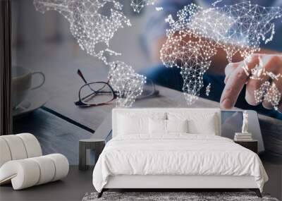 International business network with connected lines, worldwide communication for internet of things, finance, trading, blockchain and web technologies, concept wit businessman using tablet computer Wall mural