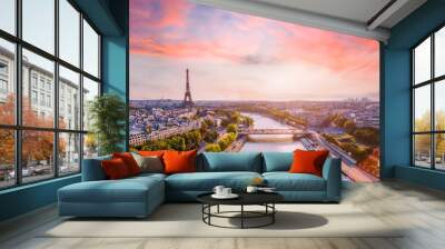 Paris aerial panorama with river Seine and Eiffel tower, France. Romantic summer holidays vacation destination. Panoramic view above historical Parisian buildings and landmarks with sunset sky Wall mural