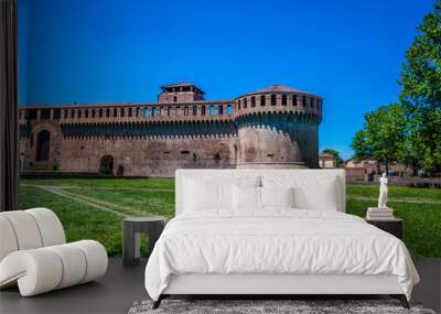 A view towards the southern corner of fourteenth century stone castle in Imola, Italy  in summertime
 Wall mural