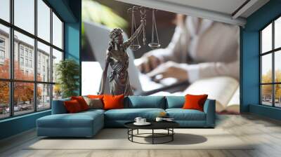 Statue of Justice and lawyer working on a laptop Wall mural