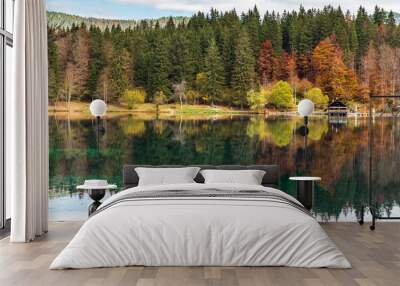 Autumn sunrise on the lower lake of Fusine. Explosion of colors Wall mural