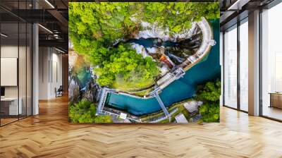 Waterfall and dam in the Julian Prealps. Crosis, pearl of Tarcento. Nature and engineering. Wall mural