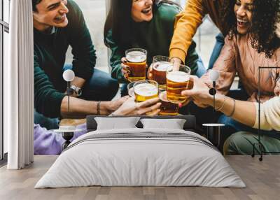 Group of multiracial friends drinking and toast beer at brewery pub enjoying happy hours-Young diverse people having fun at bar during summer party -Youth culture-Life style Food and beverage concept  Wall mural