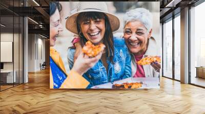 Women eating pizza outdoors at city - Happy three senior having fun together outside on street and laughing with food- Friendship and lifestyle concept Wall mural