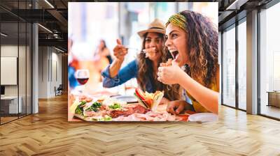 Young people dining at restaurant and having fun drinking red wine together sitting outside at pub terrace-Cheerful People with food laughing and enjoying at happy hour  Wall mural