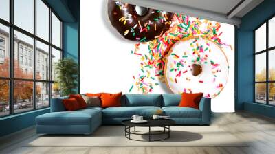 Chocolate, vanilla, and maple frosted donuts with rainbow sprinkles on a white background Wall mural