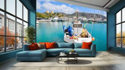 Traditional fishing boat docked at Moraira port, Costa Blanca, Spain Wall mural