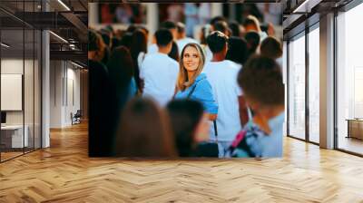 Smiling Woman in a Crowded Place Standing Out. Special individual being unique in her community opt people 
 Wall mural