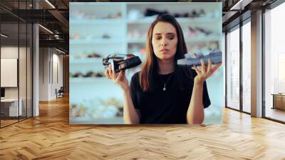 Woman in Shoes Store Comparing Two Comfortable Summer Sandals. Indecisive customer trying to make an ethical decision  
 Wall mural