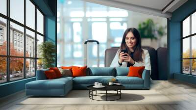 Woman Reading Phone Messages in Airport Waiting Room Wall mural