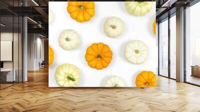 White and orange small pumpkins on a white background. Pumpkins pattern on white backdrop with copy space. Squash background for Thanksgiving Day and harvest festival. Wall mural