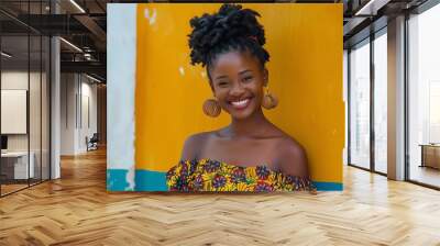 A Black woman with a big smile and curly hair. Wall mural