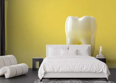 White tooth on a yellow background. Wall mural