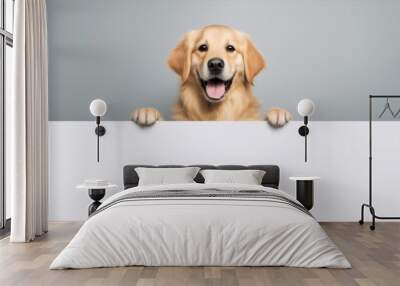 A golden retriever dog is holding a blank sign in its paws. The dog is smiling and looking up at the camera Wall mural