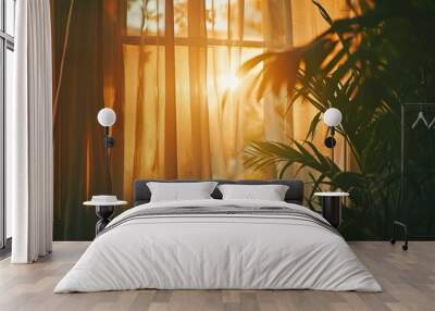 ray of sun lighting through and palm leaves and transparent curtain on window into bedroom at evening summer time. Bright morning sun in the open window through the curtains  Wall mural