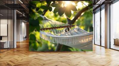 Artistic angle Close-up of a hammock strung between two trees, focusing on the gentle curve of the hammock and the dappled sunlight filtering through the leaves

 Wall mural