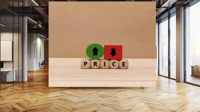 up and down arrow symbols, and the word Price on a wooden cube. the concept of changes in price increases and decreases . business finance Wall mural