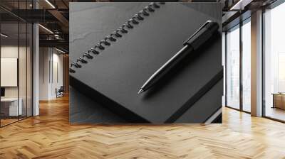 a black notepad and black pen Wall mural