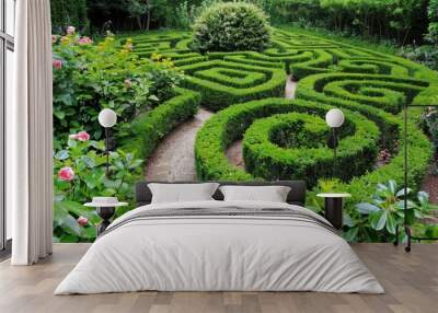 A hedge trimmed like a puzzle maze, creating a labyrinthine garden path Wall mural