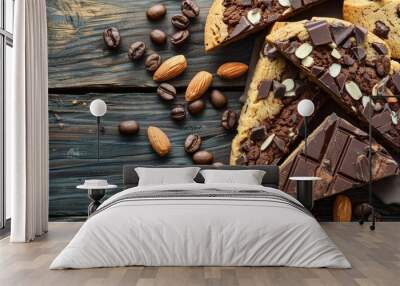 Composition with tasty biscotti cookies, chocolate, almonds and coffee beans on color wooden background, closeup Wall mural