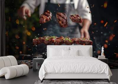 Flying beef steaks above the grill with chef on background. Concept of food preparation, grill and barbecue Wall mural