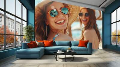 Happy beautiful women with sunglasses at sunny beach bar. summer vacation concept Wall mural