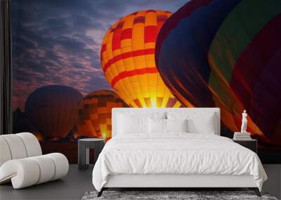 In Cappadocia, Turkey, vibrant hot air balloons preparing for takeoff early in the morning Wall mural