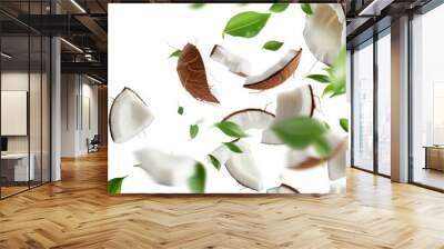 Isolated coconut slices and pieces with leaves on a white background. White broken coco flying composition with full depth of field Wall mural