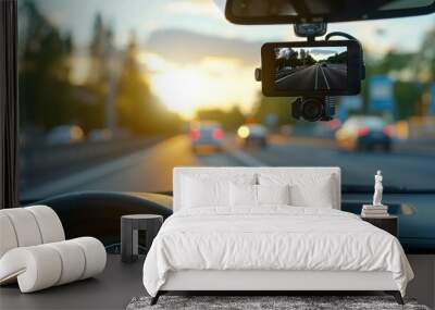 Modern dashboard camera mounted in car, view of road during driving Wall mural