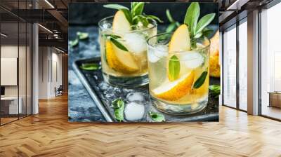 On the steel tray, a fresh and healthful mocktail or cocktail with ice, pear, and herbs. a cool beverage in the garden Wall mural